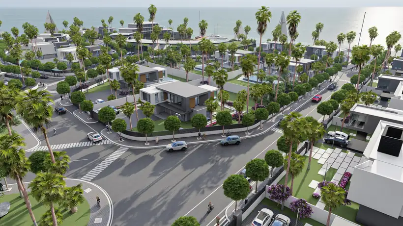 Avenue plantée de palmiers entre deux rangées de villas