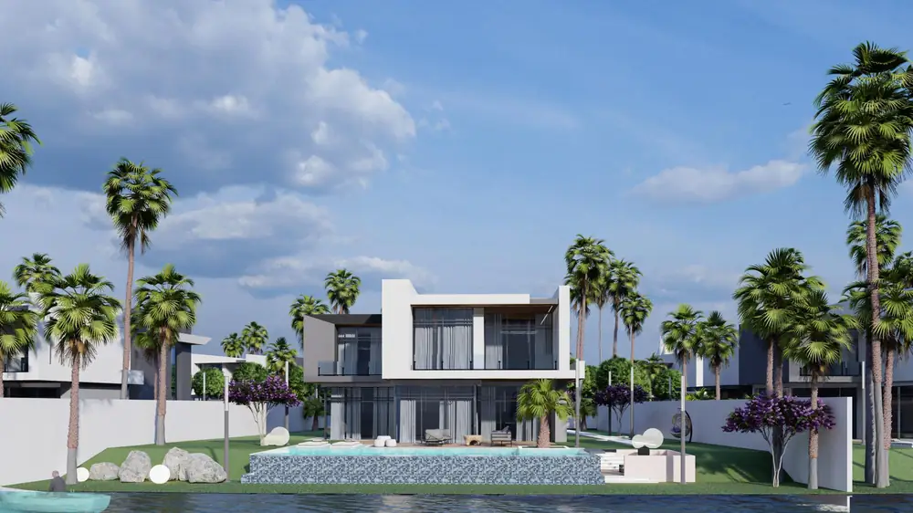 Villa de type C vue depuis l'eau avec sa piscine et ses palmiers
